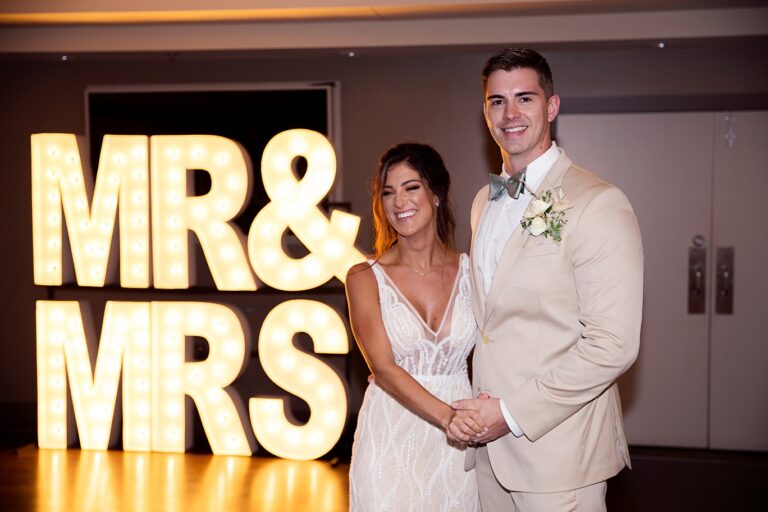 bride and groom grand enterance with mr mrs sign 2021 pic 2 768x512