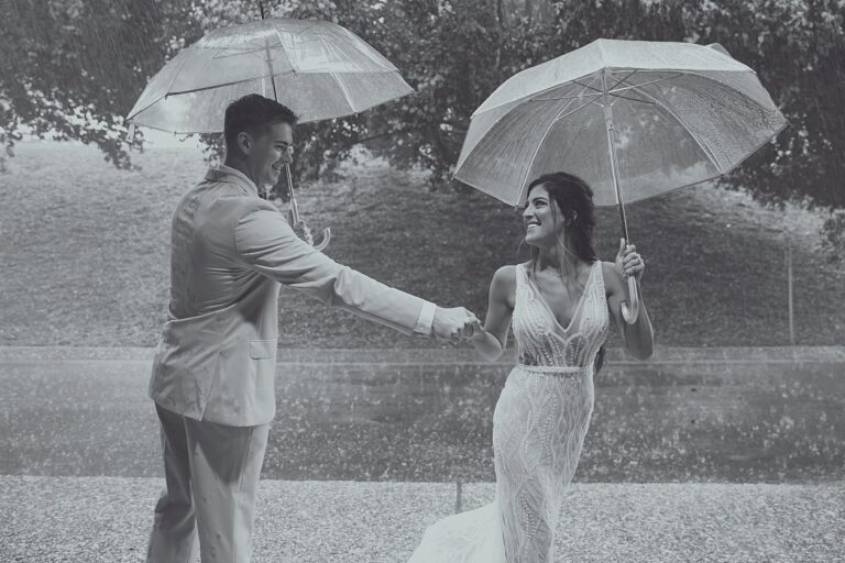 bride and groom in rain 2021 pic 2 768x512